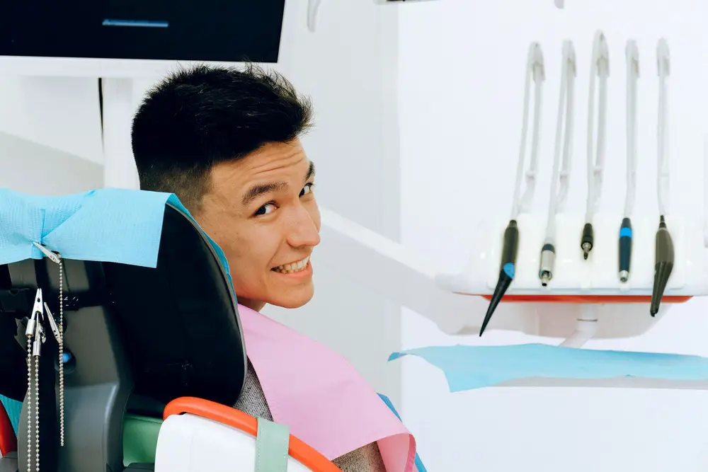 Smiling patient in a dental chair